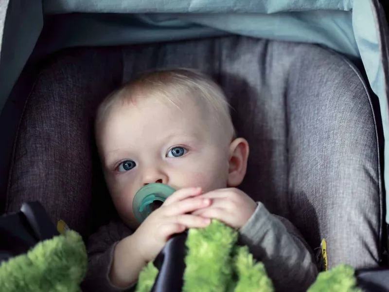 Child sat in a car safety seat