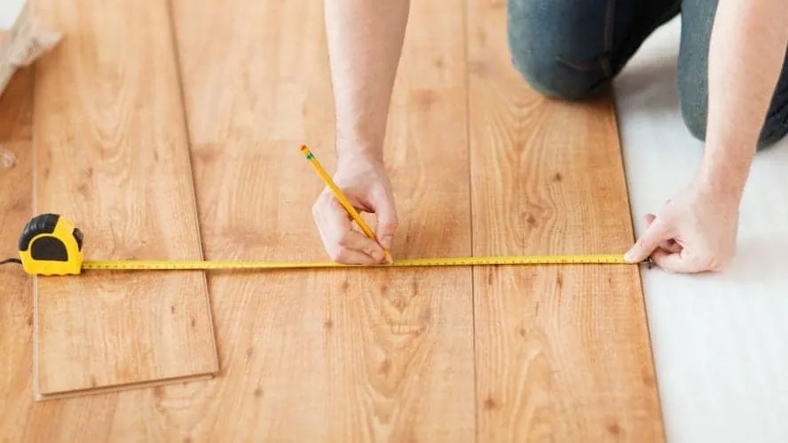 Measuring laminate flooring before cutting
