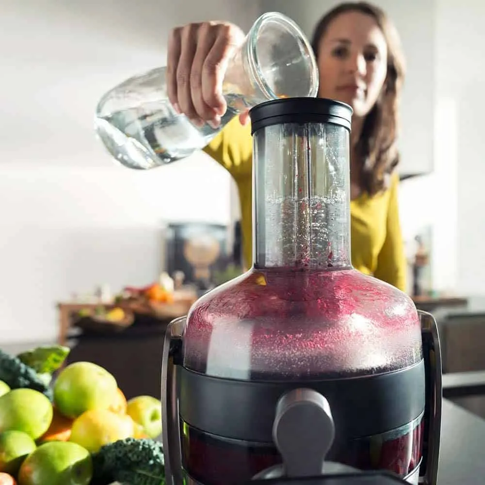 Lady using a juicer