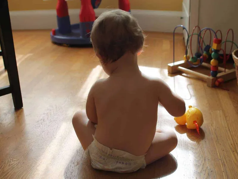 Baby sat on floor playing