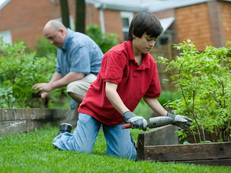 Teenager helping with the gardening