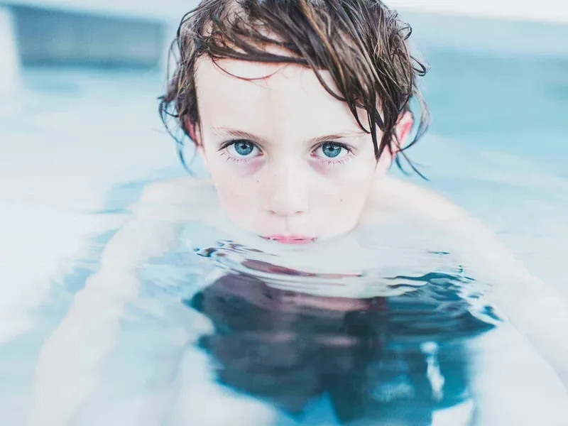 Boy learning to swim