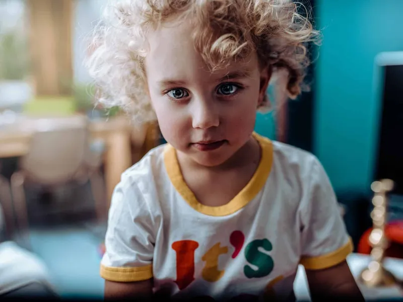 Boy with curly blonde hair