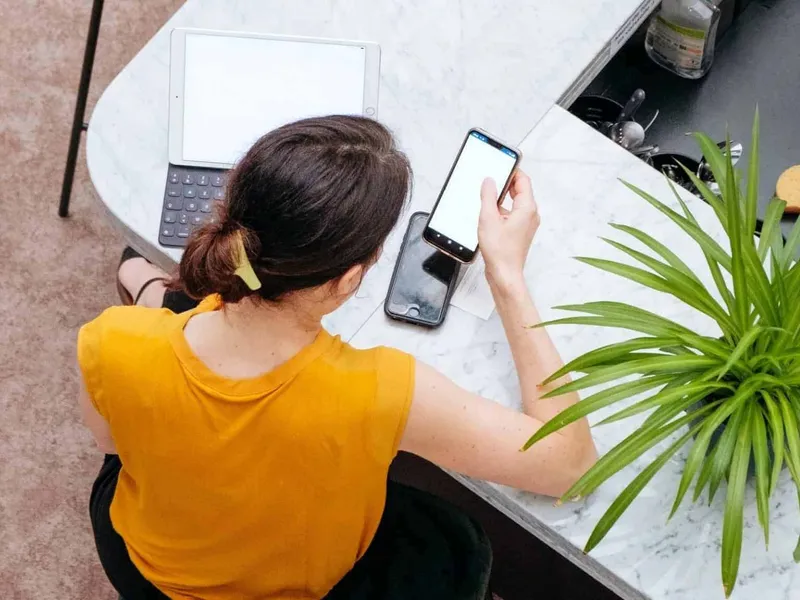 An anxious mum checking her mobile