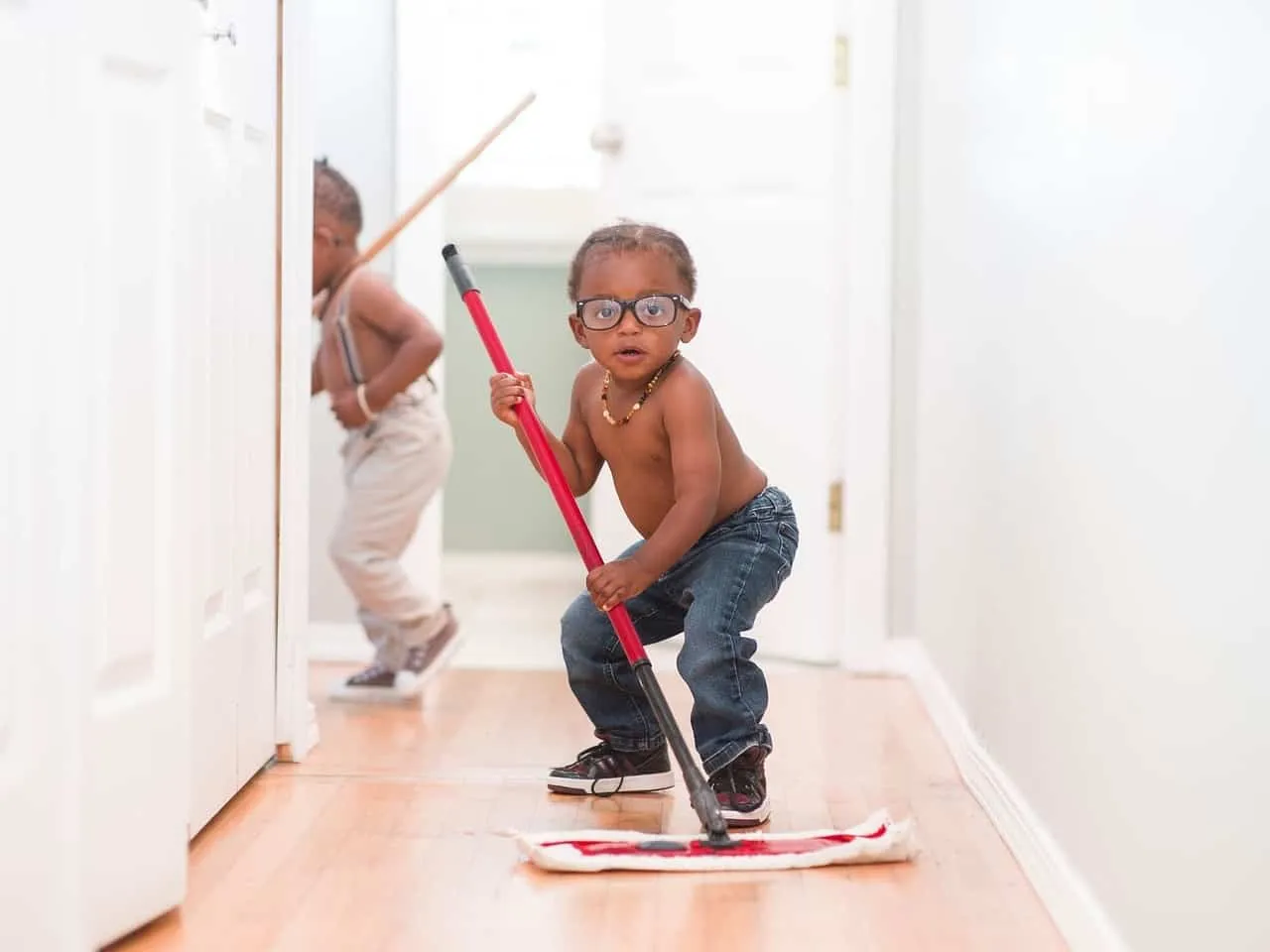 child mopping floor