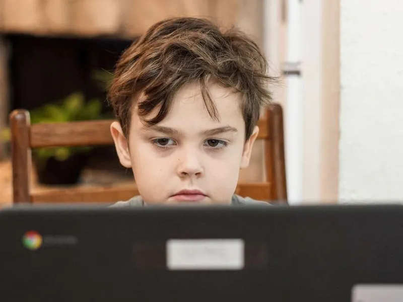 Boy using a laptop computer