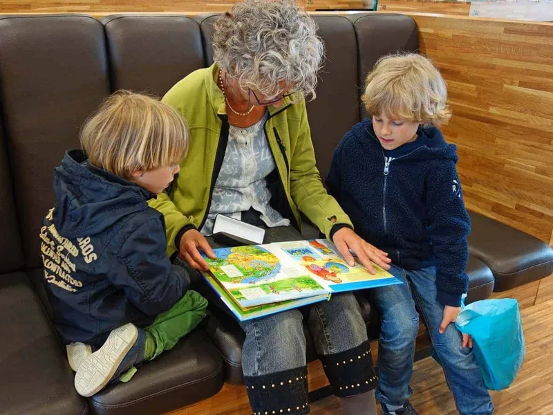 Grandma reading to her grandkids