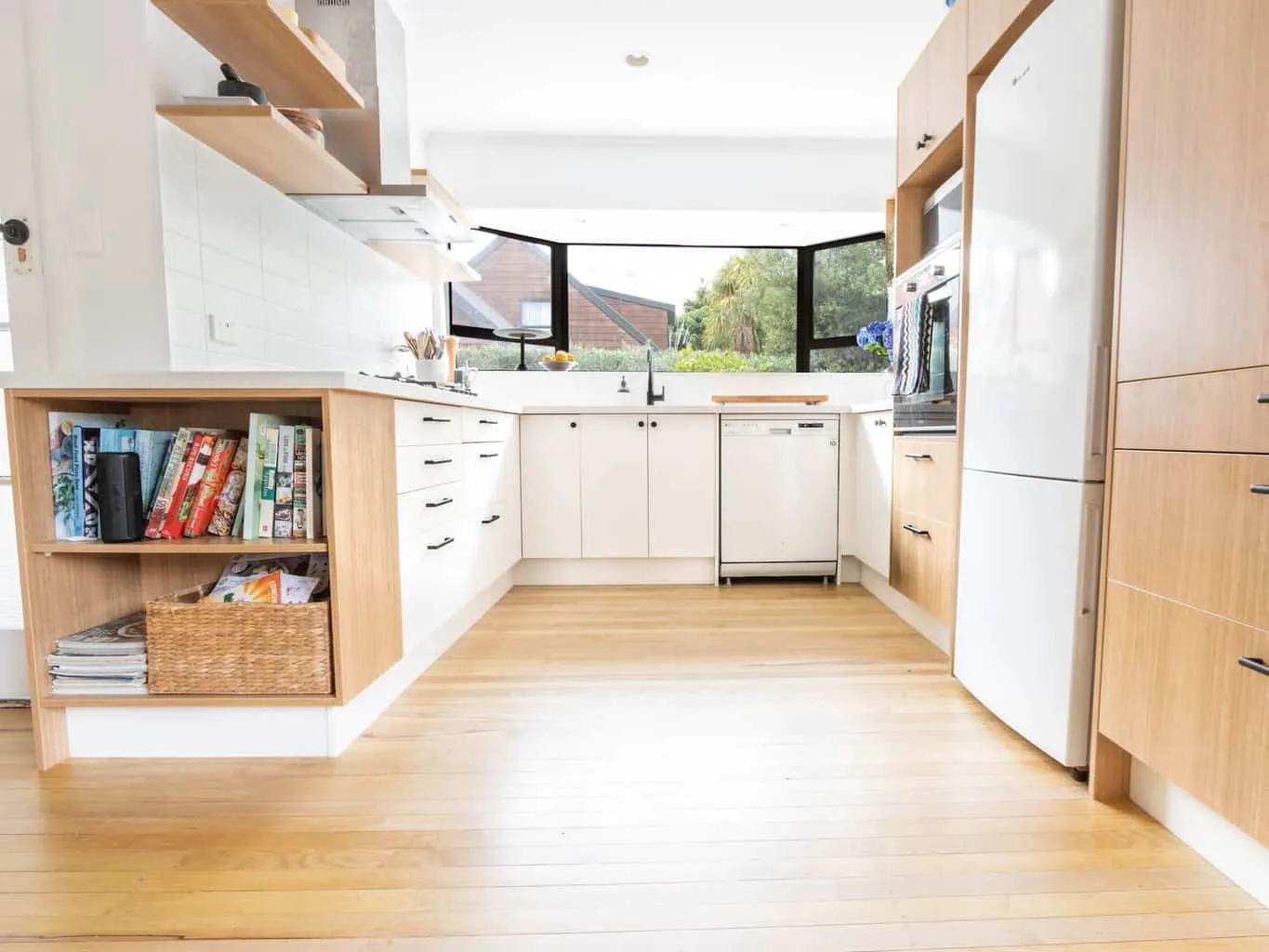 Kitchen area with laminate wood flooring
