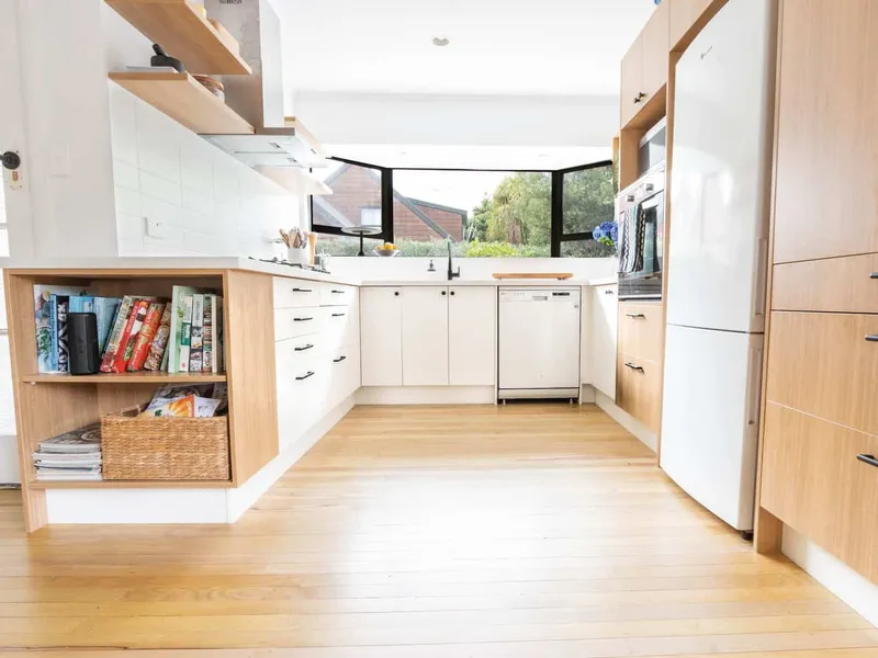 Kitchen area with laminate wood flooring