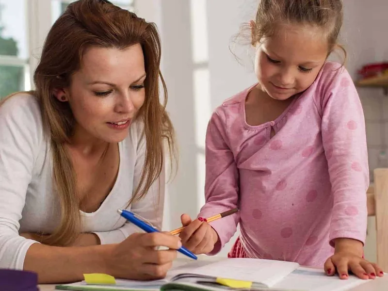 Mum and daughter doing homework together