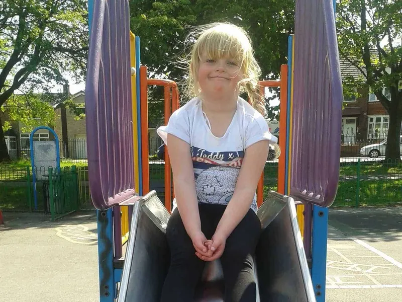 Young girl on slide