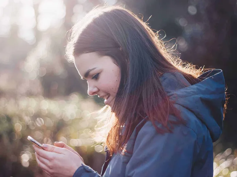 Teen looking at phone