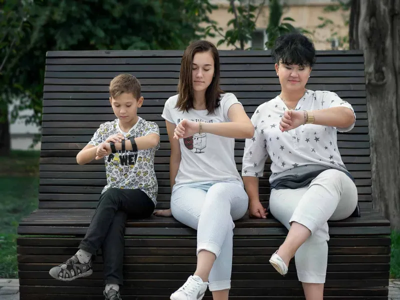 Family synchronizing their watches