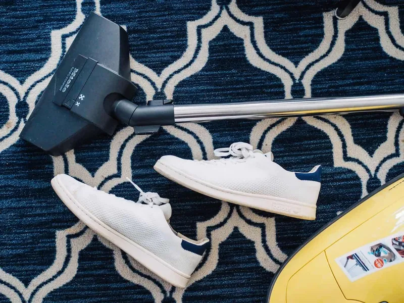 Cleaning a carpet with a vacuum